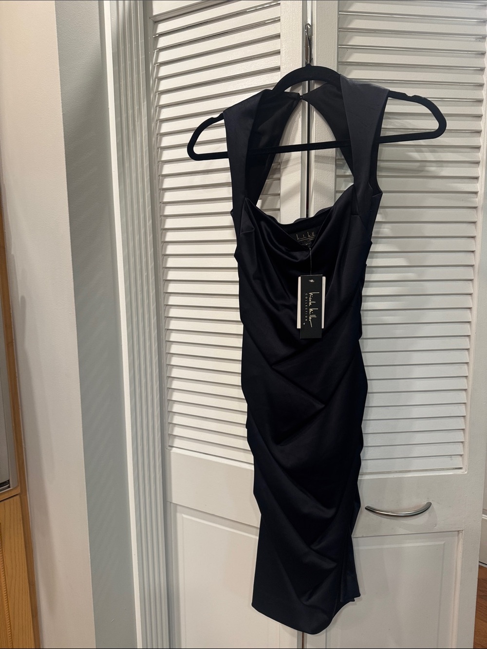 Ladies Nicole Miller Black Sleeveless Draped Midi Dress. Never worn size 0.